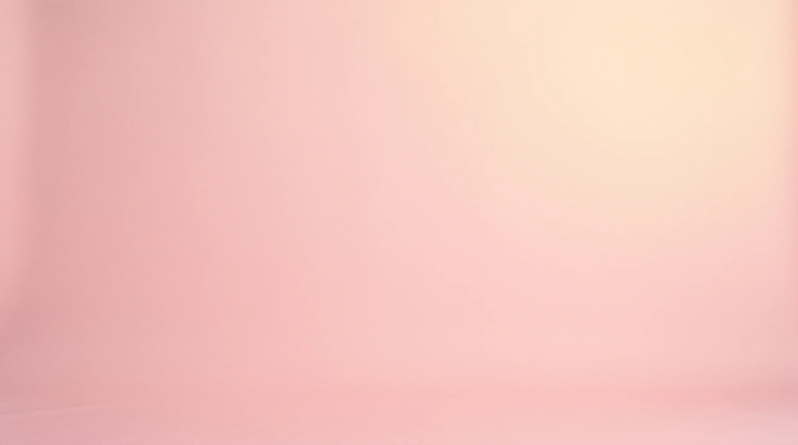 Bold pastel pink studio field graduating into pale yellow